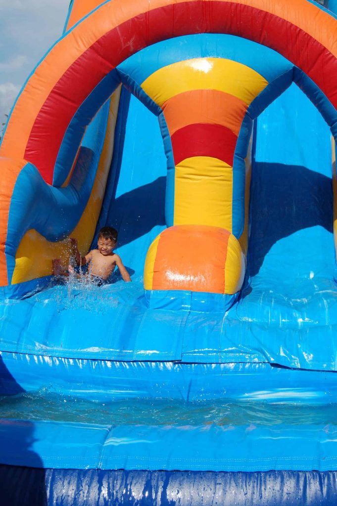 a kid having fun on water slide rentals in mountain top, pennsylvania